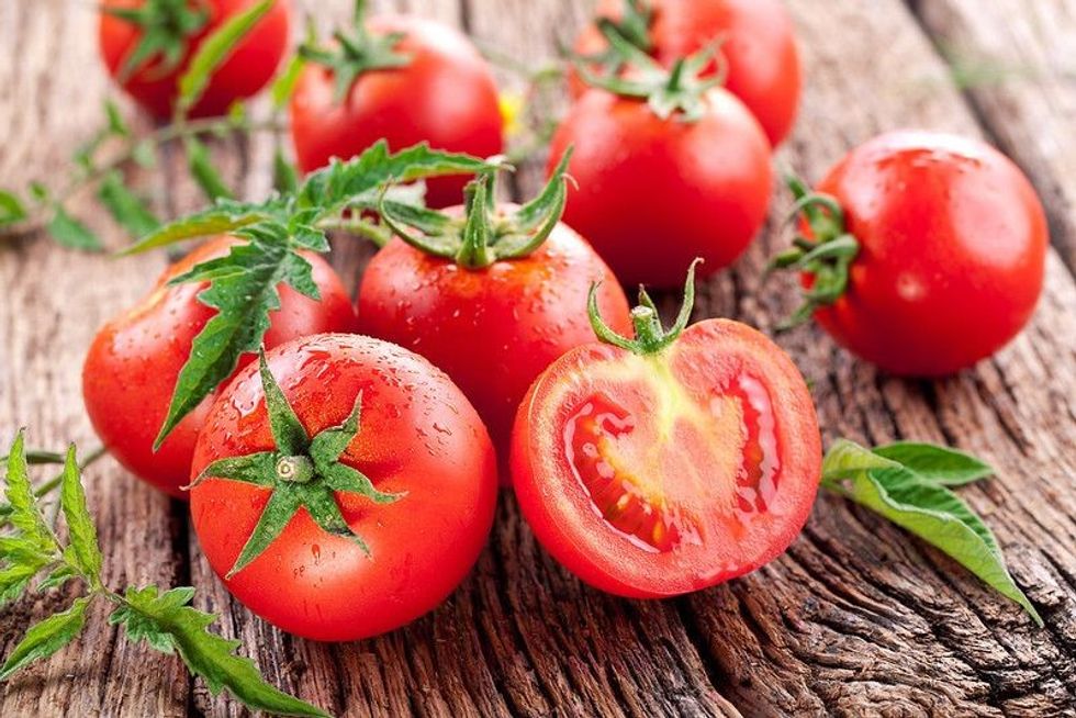 Tomatoes on the old wooden table
