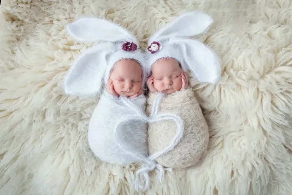Two sleeping babies in the rabbit costume