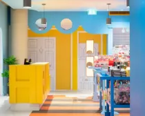 Vibrant yellow and blue interior of the Cartoon Museum.