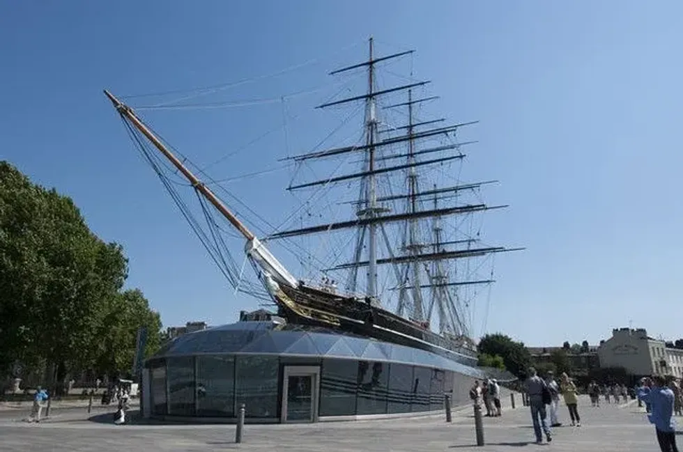 View of Cutty Sark boat against blue sky.