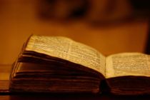 Vintage book in candle light