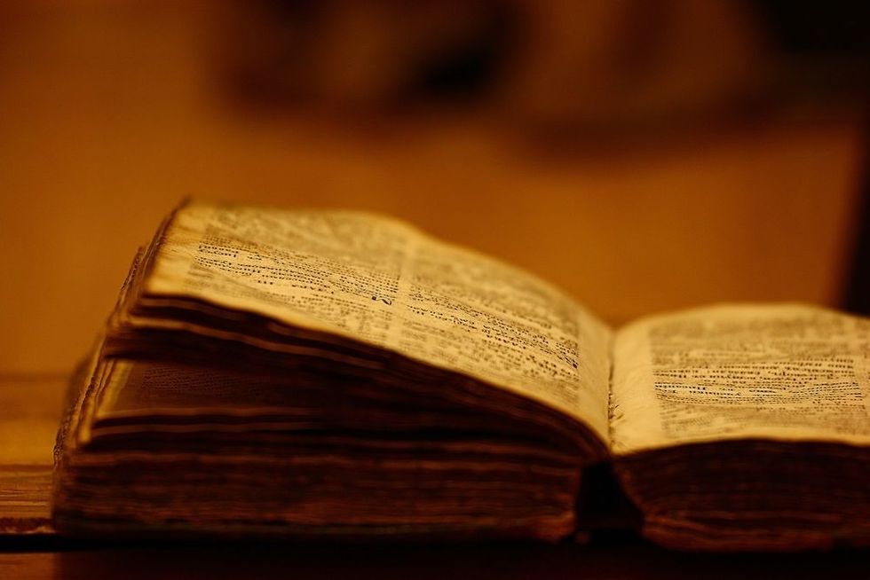 Vintage book with candle.