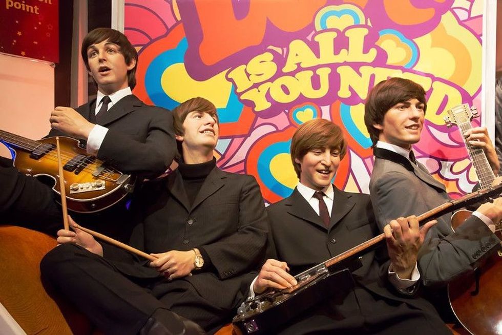 Wax statues of The Beatles in Madame Tussauds of London.