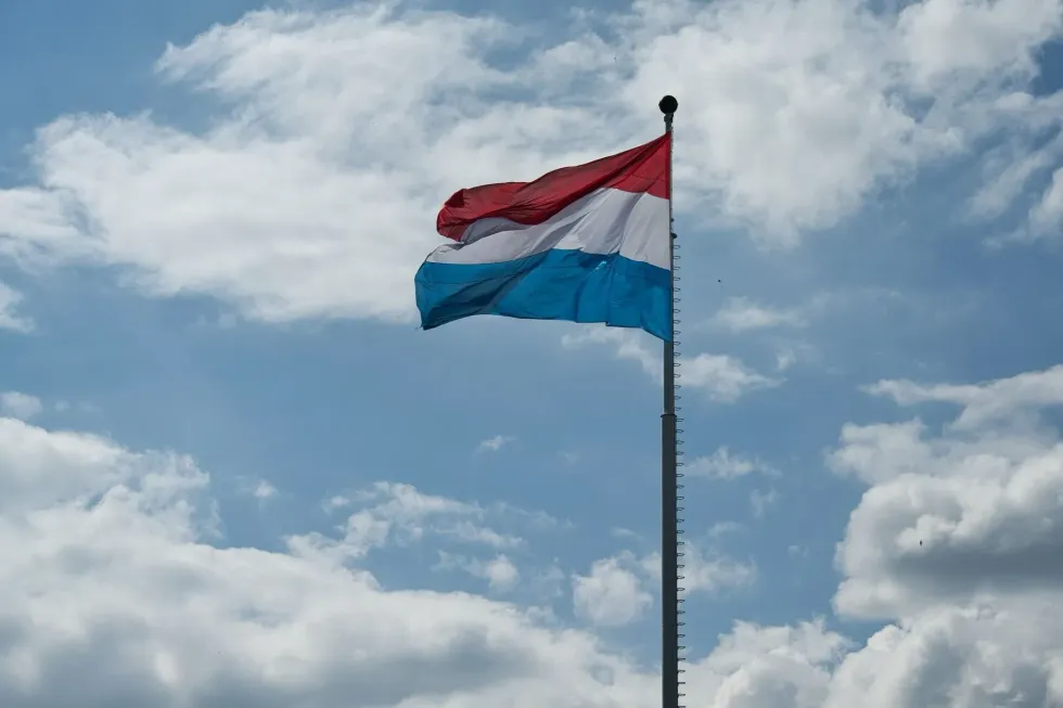 What is the Luxembourg flag meaning? What role does it play in the country's history?