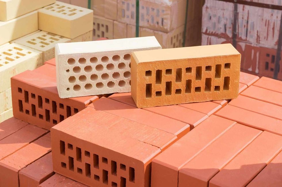 White and red brick with a round, rectangular holes