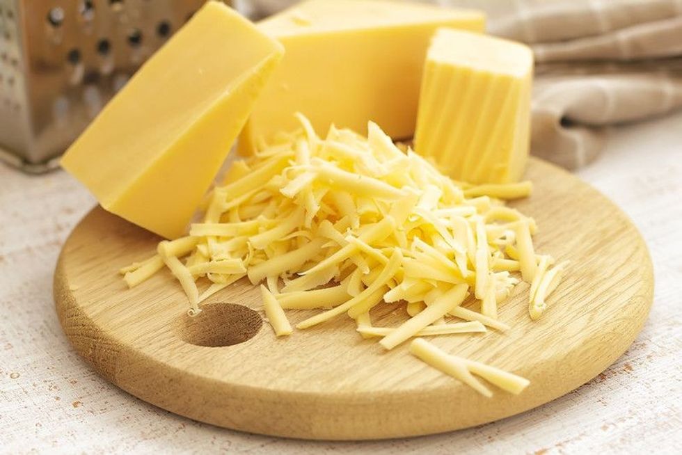 White Cheddar Cheese on wooden board