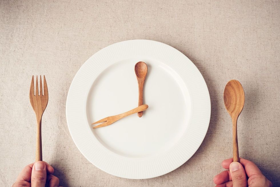 White plate with spoon and fork