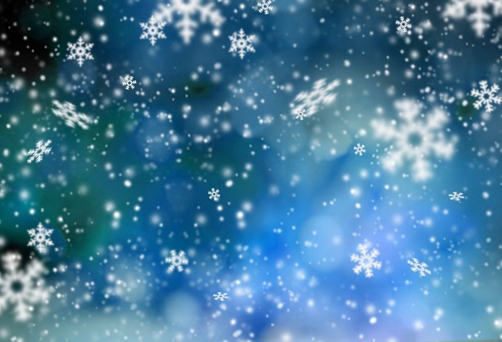 White snow flakes on the blue background