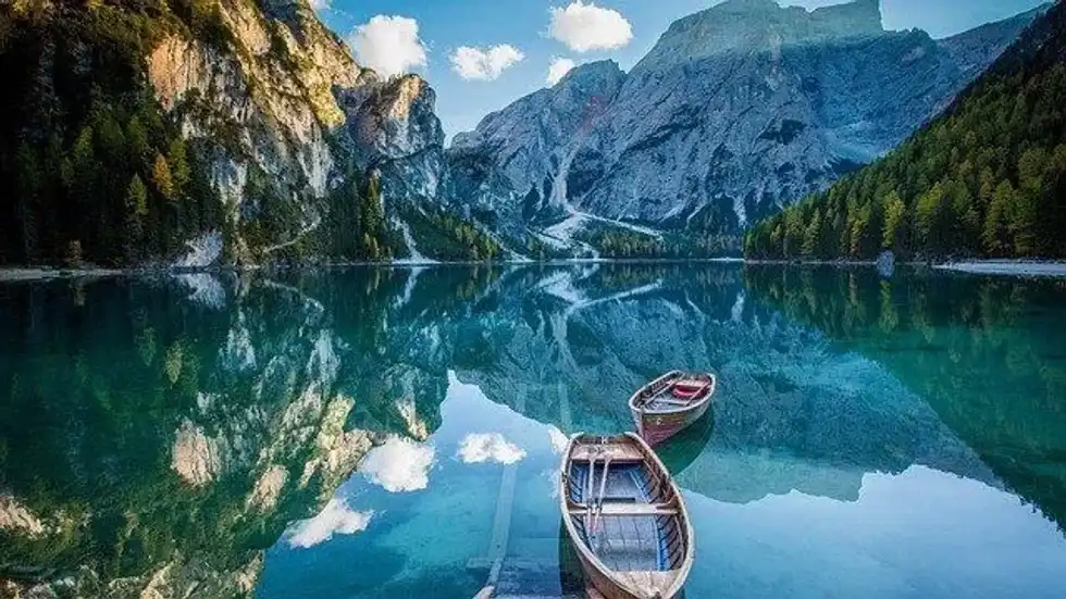 Why do boats float and not sink instead?