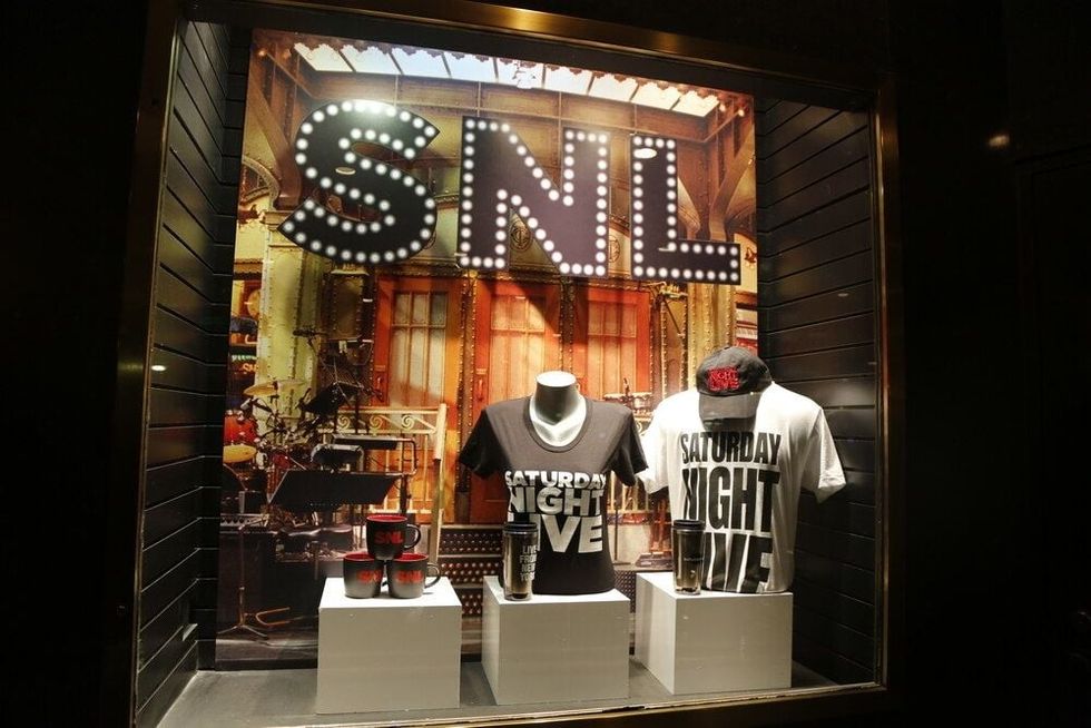 Window display decorated with Saturday Night Live Show logo in Rockefeller Center in Midtown Manhattan