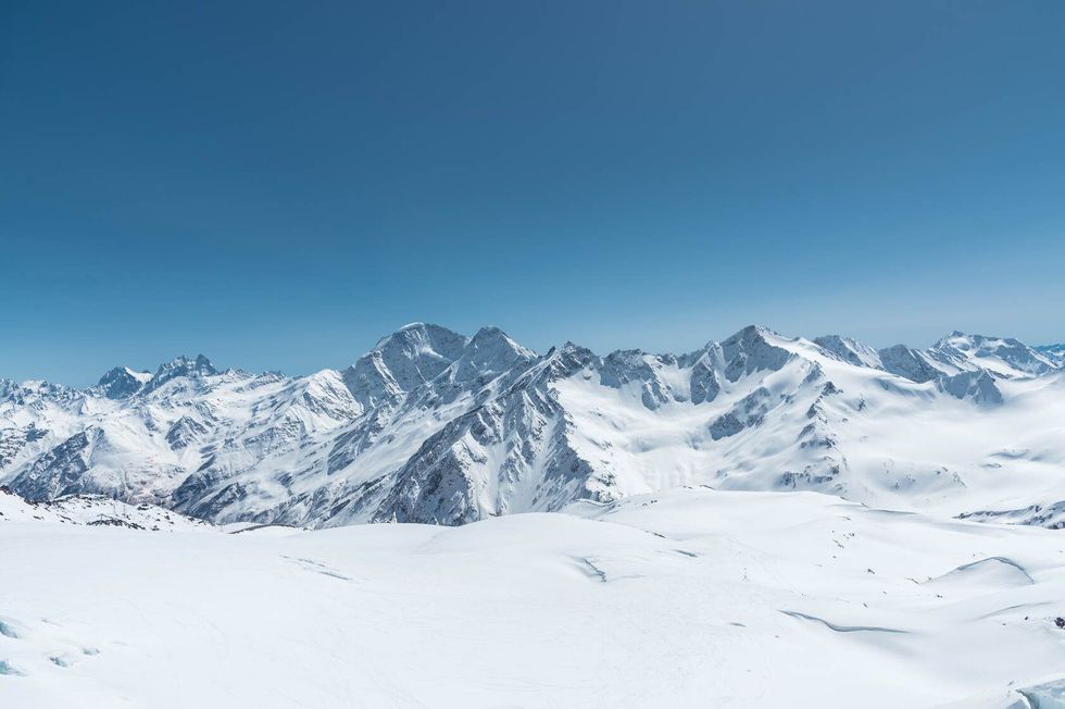Winter snow covered mountain peaks in Caucasus.