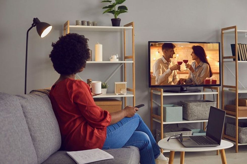 Woman enjoying good romcom serial in the evening