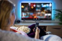 Woman home watching tv