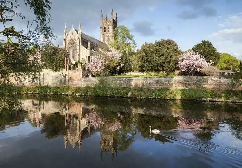 Worcester Cathedral towering above the River Severn.