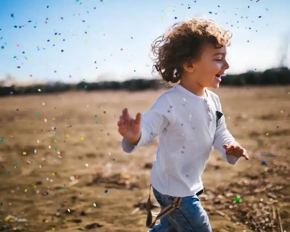 Young child running outside.