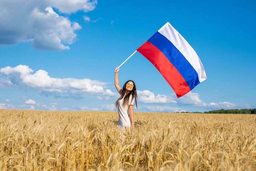 Young girl waving the Russian flag
