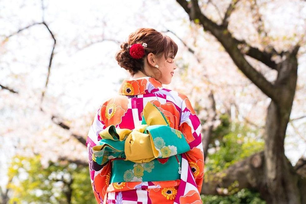 Young Japanese girl wearing traditional kimono for Coming-Of-Age Day Celebration.